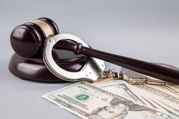 judge-gavel-with-money-and-handcuf